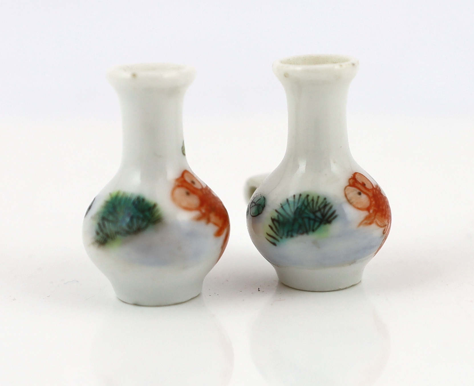 A pair of Chinese enamelled porcelain ‘goldfish’ bird feeders, Guangxu period
